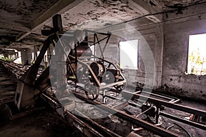 Old abandoned silo elevator with rusty equipment left