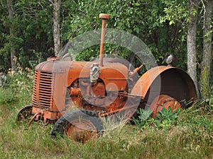 Old abandoned small farm tractor