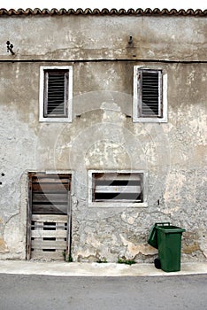 Old abandoned stone house in front view