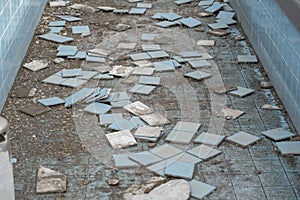 old abandoned swimming pool with fallen tiles