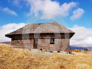 Old abandoned traditional rustic wood house. Fundata Romania