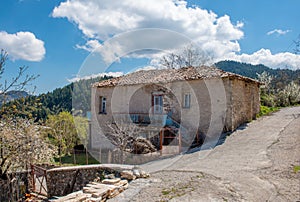 Old abandoned traditional stone house on mountain village named