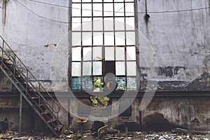 Old abandoned train station building and broken window