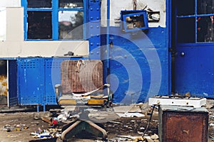 Old abandoned train station building and broken window and chairs