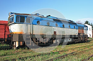 Old abandoned trains at depot in sunny day