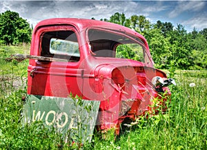 Old abandoned truck in farm field