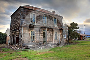 Old abandoned two storey wooden farmhouse