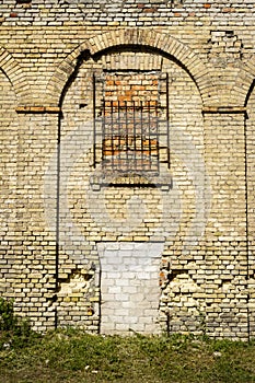 Old abandoned wall with bricked up windows