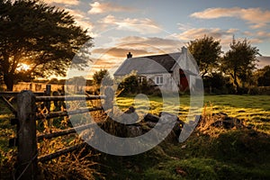 Old abandoned white house on a rural landscape