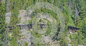 Old abandoned wood railroad track bridge on the mountainside of the Rocky Mountains of Colorado