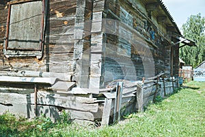 An old abandoned wooden building in a village manor photo