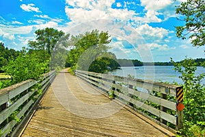 The Old Abe Trail passes over a wooden bridge along the Chippewa River near Jim Falls, WI.