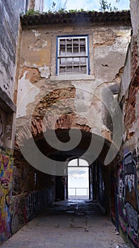 Old adandoned building with passage from inner yard to outside (in Portugal)