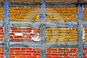 Old adobe and brick wall of half timbered house