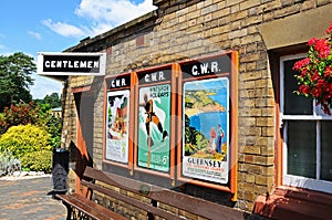Old adverts on railway station wall, Arley.
