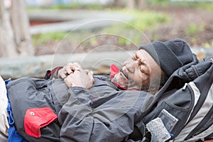 Old african american homeless man sleeping