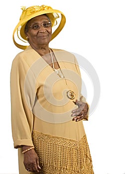 Old african american woman wearing yellow hat