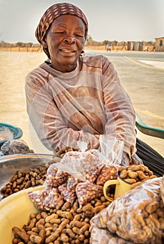 Old african woman vendor with scarf