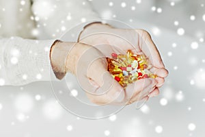 Close up of senior man hands holding pills