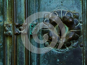 Old aged green and bronze color door lock detail with keyhole