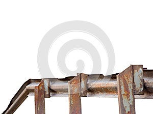 Old aged weathered bent rusty grunge metallic iron bridge rail, isolated perspective horizontal closeup, large detailed textured