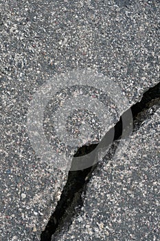 Old aged weathered cracked grey black tarmac texture pattern, large detailed damaged textured asphalt grungy background flat lay