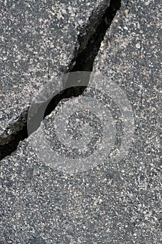 Old aged weathered cracked grey black tarmac texture pattern, large detailed damaged textured asphalt grungy background flat lay