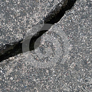 Old aged weathered cracked grey black tarmac texture pattern, large detailed damaged textured asphalt grungy background flat lay