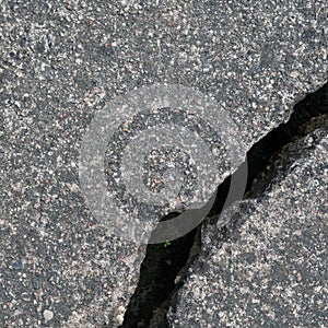 Old aged weathered cracked grey black tarmac texture pattern, large detailed damaged textured asphalt grungy background flat lay