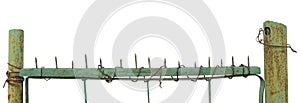 Old aged weathered green painted metallic vintage fence gate, large detailed upward driven nails closeup panorama, isolated