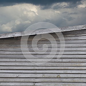 Old aged weathered natural grey damaged wooden farm shack wall texture, large detailed textured rustic grungy vertical background