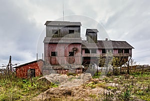 Old agricultural granary. Abandoned, forlorn collective farm.