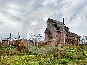 Old agricultural granary. .Abandoned, forlorn collective farm photo