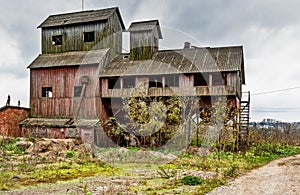 Old agricultural granary. Abandoned, forlorn collective farm. photo