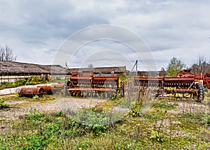 Old agricultural machinery. .Abandoned collective farm.