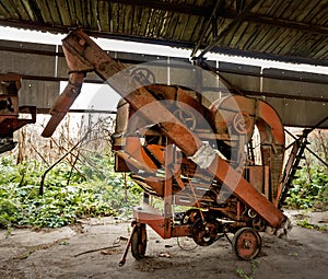 Old agricultural machinery. Abandoned collective farm.