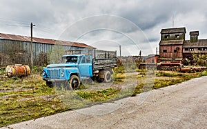 Old agricultural machinery, old truck. Abandoned collective farm.