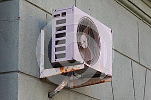 old air conditioning refrigeration unit outside the building