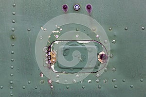 Old aircraft green hatch with rivets