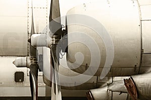 Old aircraft propeller engines airframe and blades in warm tone