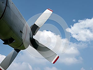 An old airplane propeller with blue sky background