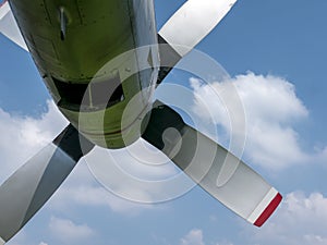 An old airplane propeller with blue sky background