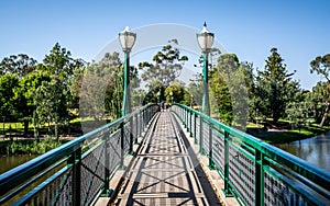 Old Albert bridge an heritage footbridge over Torrens River with street light in Adelaide South Australia