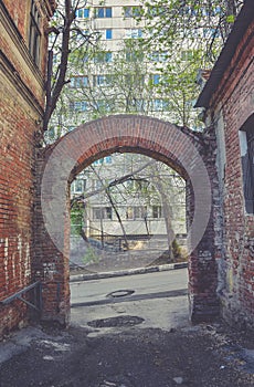 Old alley with arch from red brick