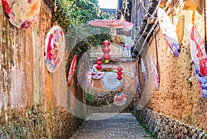 The old alley decorated with umbrellas