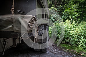 Old american army car in the woods