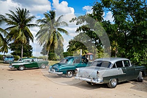 Old american car on beach in Trinidad Cuba