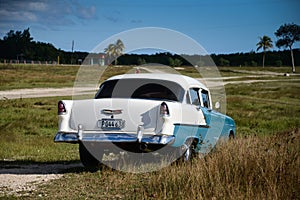 Old american car on beach in Trinidad Cuba