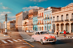 Old american car and  colorful buildings in Havana