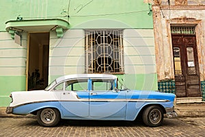 Old American car parked on the cuban street